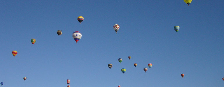 Hot air balloons against a perfect blue sky